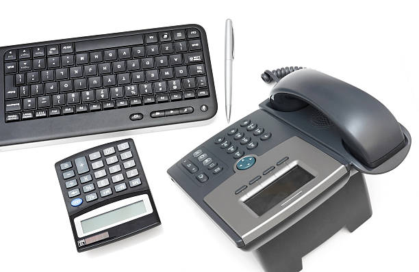 istock office desk with calculator,telephone,keyboard 177455733