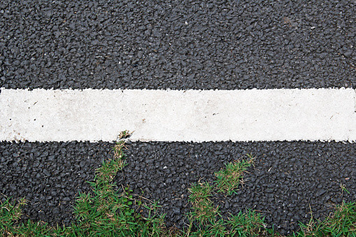 Asphalt highway road texture with markings.