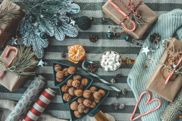 istock Christmas gifts and wrapping paper top view 1774559818