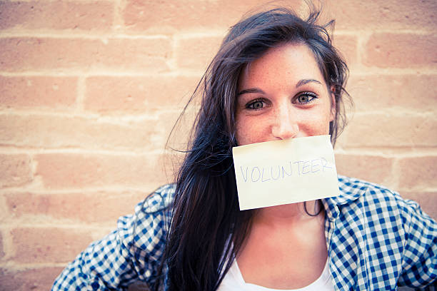 istock Young woman with volunteer paper 177458432