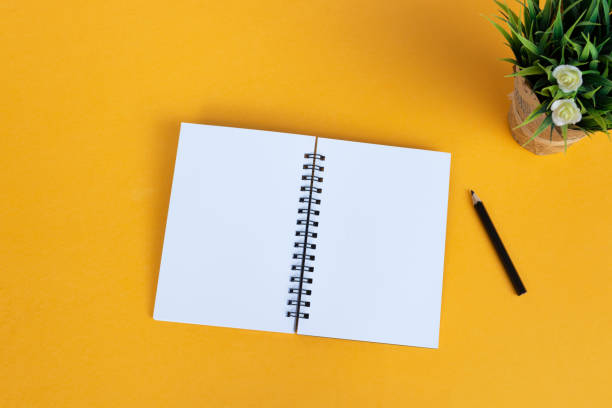 istock Directly above view of office desk with yellow background. Copy space. Flat lay. 1774584793