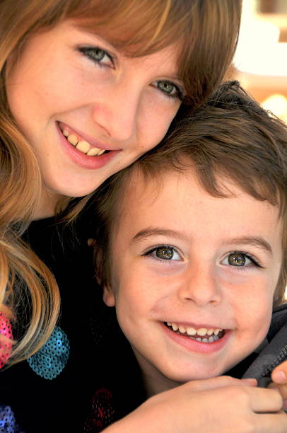 istock Big sister hugging little brother 177458990