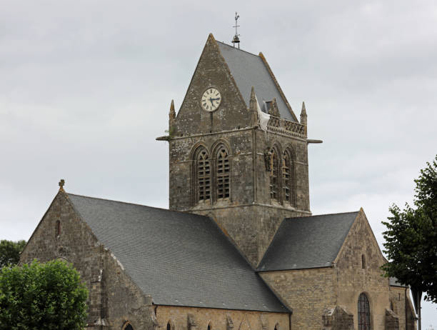 DDAY Memorial with Paratrooper on the bell tower Sainte-Mere-Eglise, FRA, France - August 21, 2022: DDAY Memorial with Paratrooper on the bell tower without people sentinel spire stock pictures, royalty-free photos & images