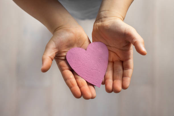 istock love and kindness, child hands holding paper heart, affection 1774647545
