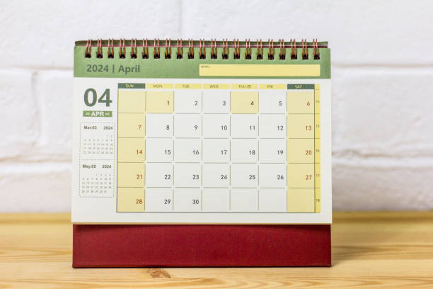 Desk calendar for April 2024 on the desktop.