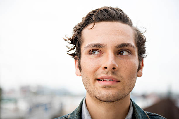 istock Young Man Looks Sideways With Crooked Smile 177467584