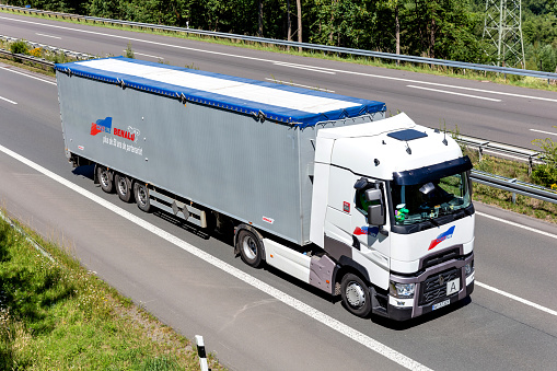 Wiehl, Germany - June 26, 2020: Coquelle Renault truck with bulk trailer on motorway