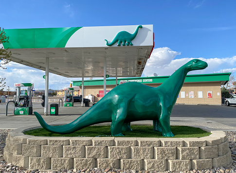 DINO, an apatosaurus or brontosaurus, mascot of Sinclair brand petroleum products, at a Sinclair gas station in Rock Springs, Wyoming, USA.