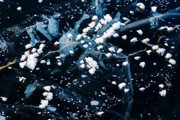 istock Winter natural phenomenon snow flowers formed by extreme temperature changes on ice and cracks in the ice 1774729016