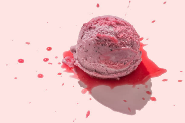 istock berries ice cream scoops with juicy icing on pink background, creative decoration, summer concept 1774729585