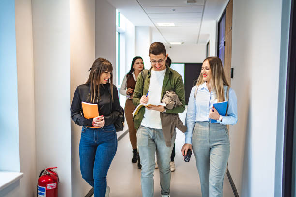istock Group of students talking before an exam in the university hallway 1774729594