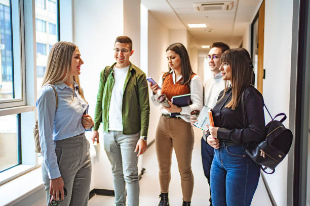 istock Small group of university students talking in the hallway before entering the classroom 1774731728
