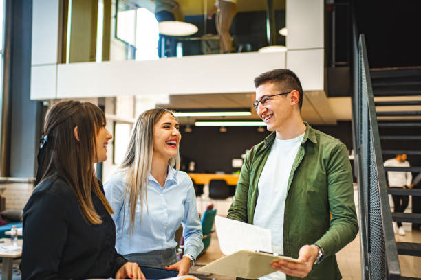 istock Three cheerful students talking about an exam in the university hallway 1774732742