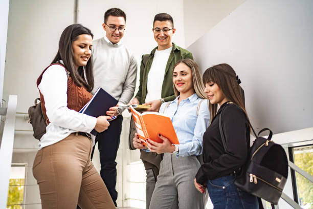 istock Group of students talking about homework on the university staircase 1774743093
