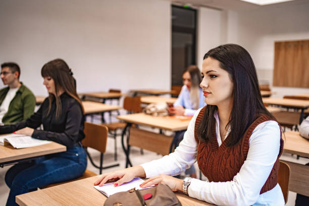 istock Students sitting in a classroom looking at the board 1774744235