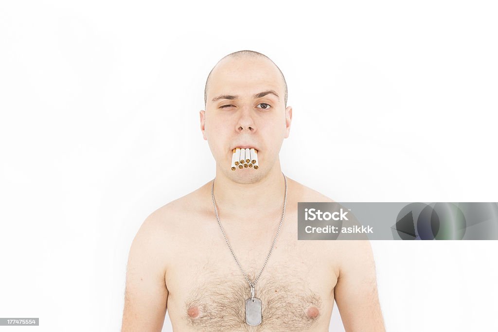 Man With a Mouth Full of Many Cigarettes many cigarettes in his man's mouth 30-39 Years Stock Photo