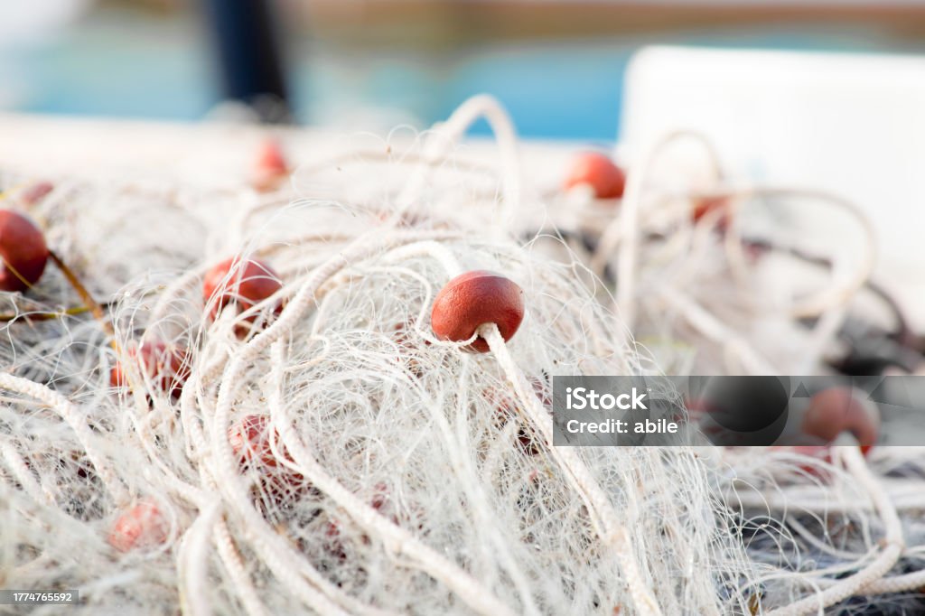 Fishing Net Close-Up Of Stacked Commercial Fishing Nets With Floats Close-up Stock Photo