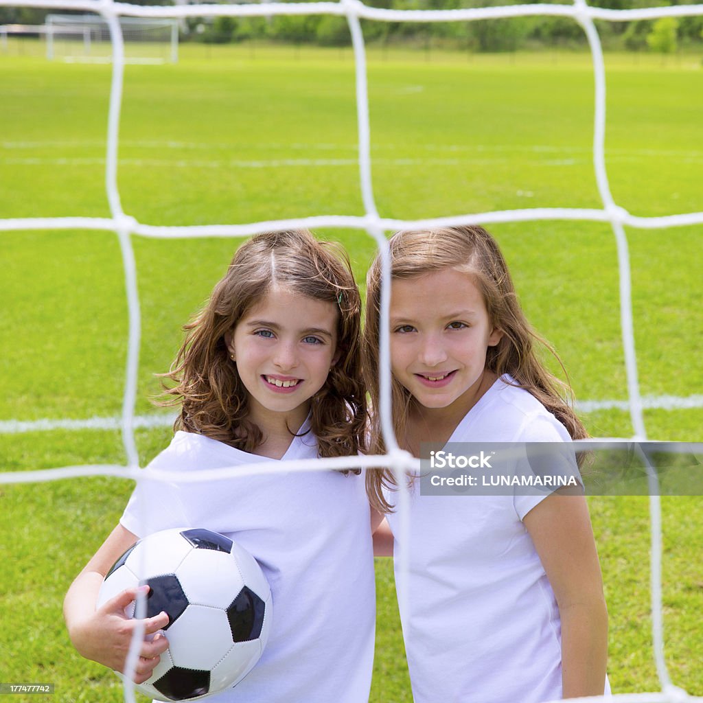 Soccer football kid girls playing on field Soccer football kid girls playing on sports outdoor field Girls Stock Photo