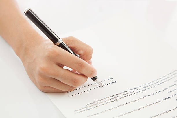 istock Female hand signing contract. 177478531