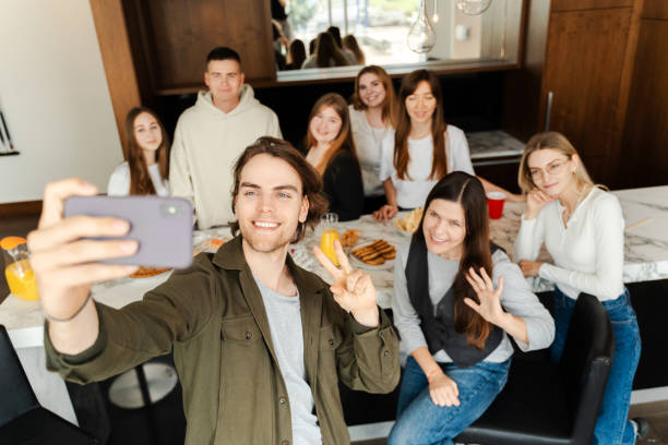 istock Group of young people taking selfie while eating sushi 1774798734