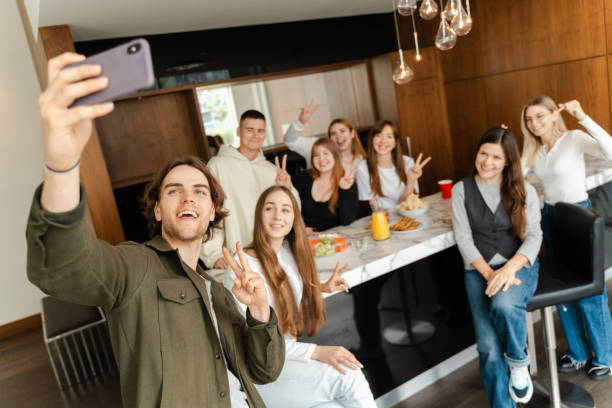 istock Group of young people taking selfie while eating sushi 1774798742