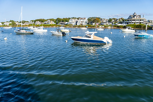 Falmouth harbour on Nantucket Sound.  There are a vast array of yachts and motorboats moored in the marina.