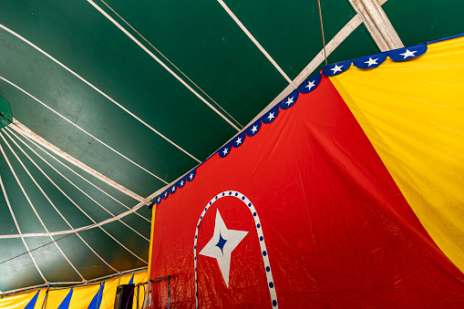 multicolored images of a circus tent in countryside of Brazil