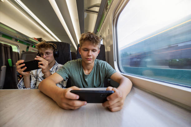 istock Teenagers travelling by modern train 1774868675