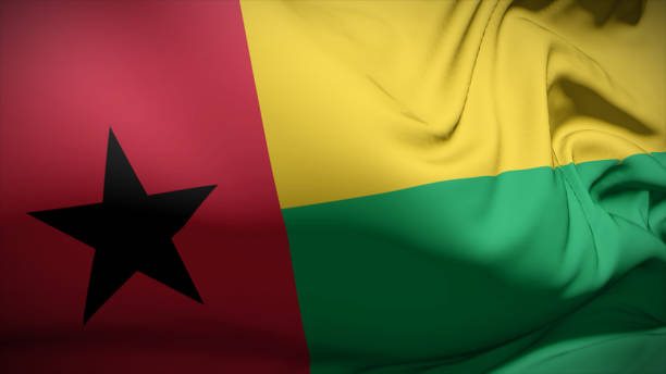 nahaufnahme der nationalflagge von guinea-bissau, die im wind flattert. - guinea bissau flag stock-fotos und bilder
