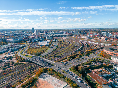 Panorama of Leipzig, in front the Leipzig train station, in the background the City Tower of Leipzig, and cloudy blue sky