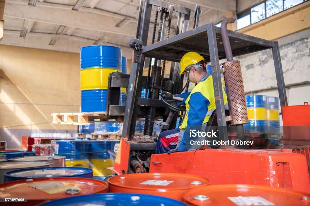 Warehouse Using Loading Tools A Warehouse Worker Is Carrying Out Loading And Unloading Activities ...