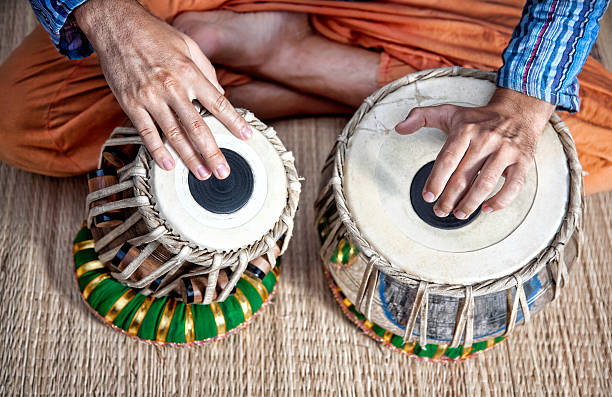 Tabla drums Man playing on traditional Indian tabla drums close up indian music stock pictures, royalty-free photos & images