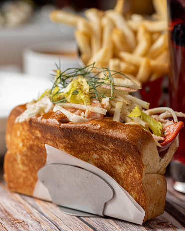 The lobster meat used in a lobster roll is often sourced from fresh, tender chunks of sweet and tender lobster tail and claw meat. It's a true testament to the bounty of the sea, delivering a delicate, slightly sweet, and briny taste that's simply irresistible.