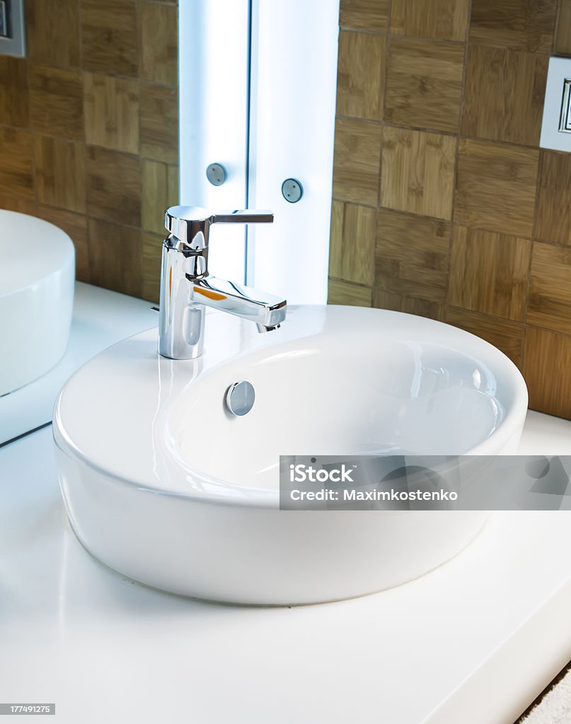 Modern bathroom sink in white ceramic Bathroom Stock Photo