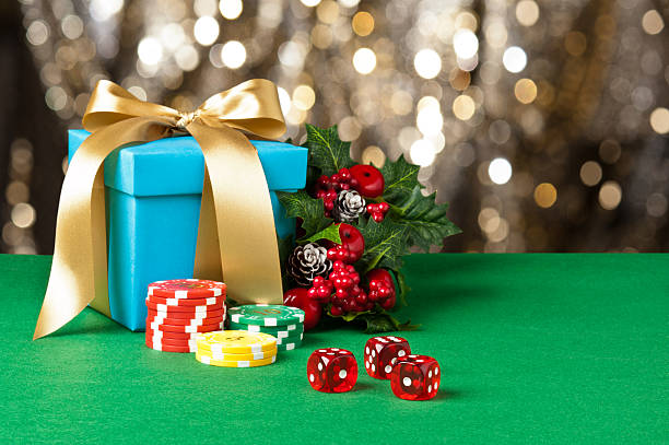 Red dice and poker chips Red dice and poker chips in Christmas setting christmas casino stock pictures, royalty-free photos & images