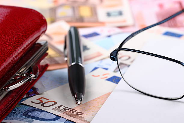 Wallet, pen and money stock photo