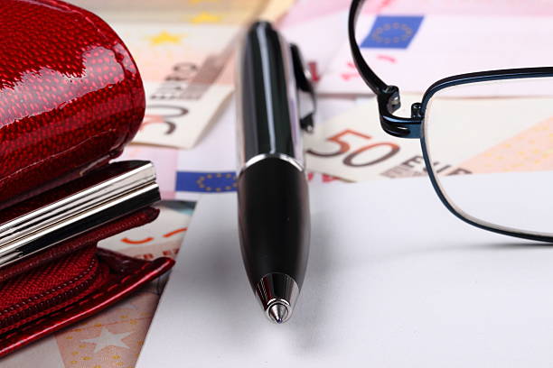 Wallet, pen and money. stock photo