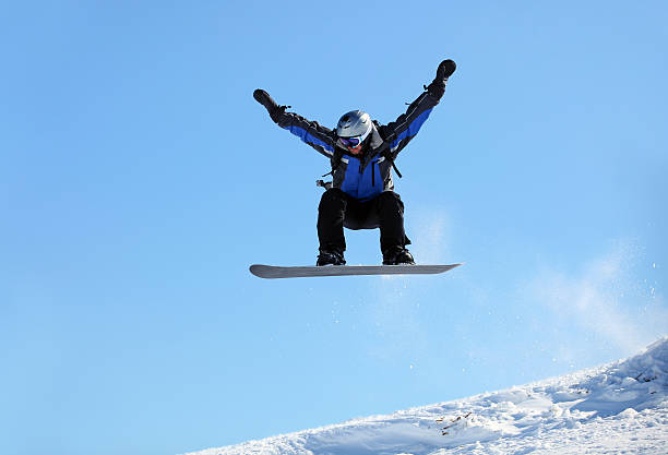 istock Snowboarder jumping against blue sky 177492662