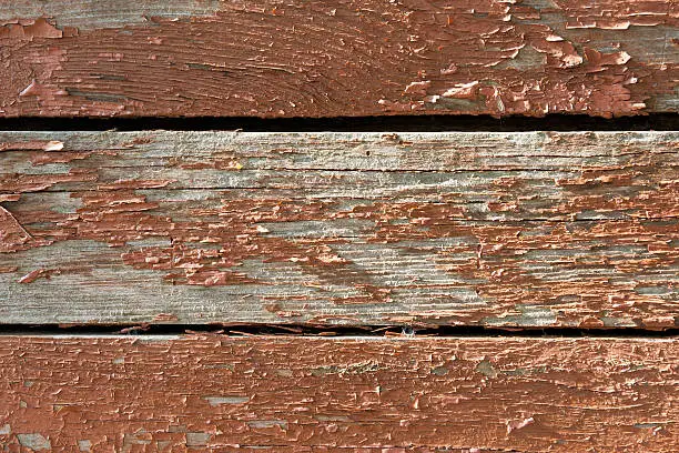 Skinning paint background of three timber boards