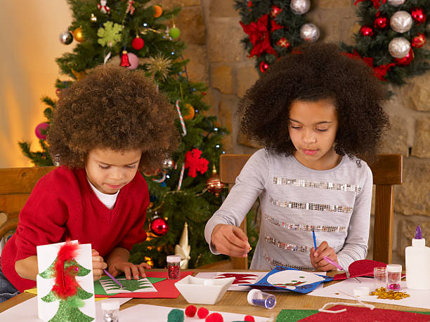 istock Mixed race children making Christmas cards 177493396