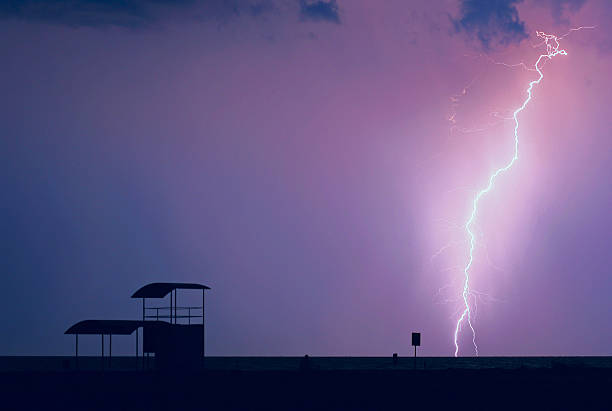 Thunderstorm and Lightning over beach stock photo