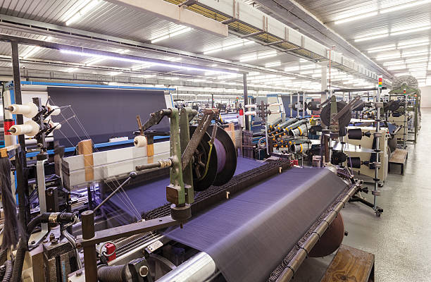 producción textil es de tejido - textile industry fotografías e imágenes de stock