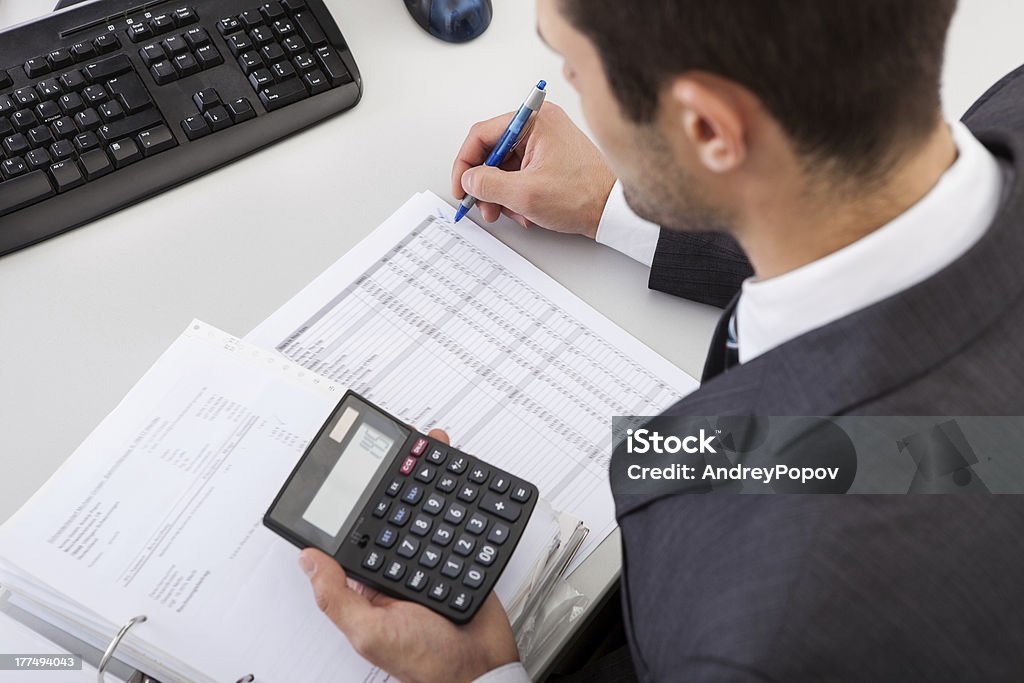 Accountant working at the office Successful accountant working with financial data in the office Financial Advisor Stock Photo