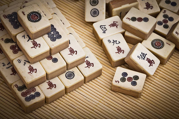 istock Old chinese game mahjongg on bamboo mat background 177494272