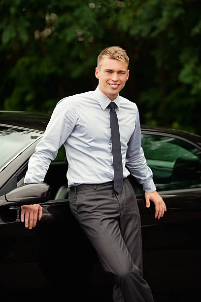 istock Businessman standing next to his car 177494599
