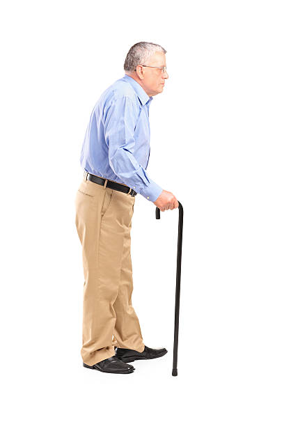 istock Senior man walking with a cane 177495037