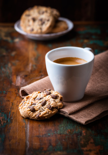 Coffee with Chocolate chip cookies on wooden table