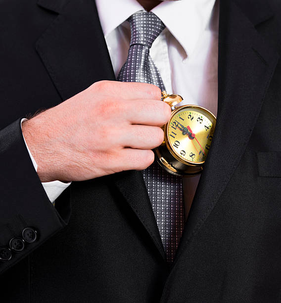 istock Business man pulling a clock out of his jacket 177495579