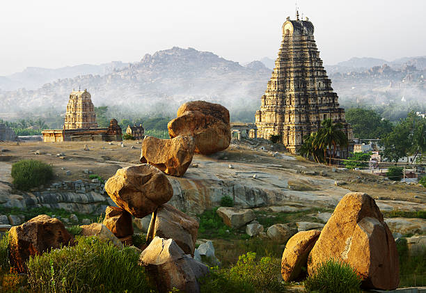 Hampi with foggy mountains in background stock photo