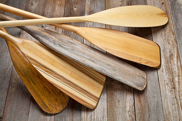 istock Five stacked wooden canoe paddles 177496743